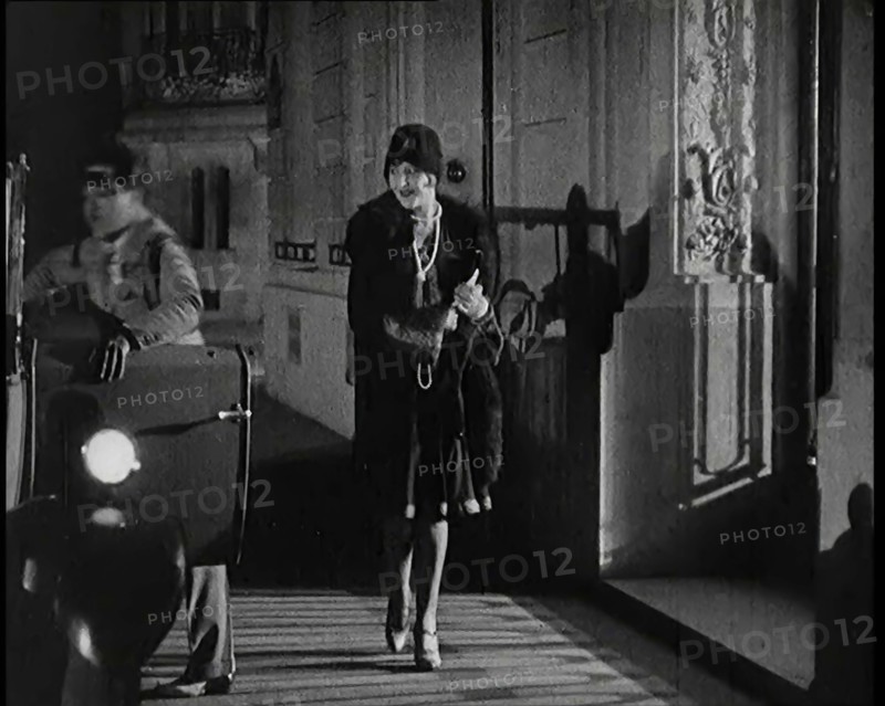 Scene from the Film 'The Compulsory Husband':  The Actor Monty Banks Opening the Car..., 1920s. Creator: British Pathe Ltd.
