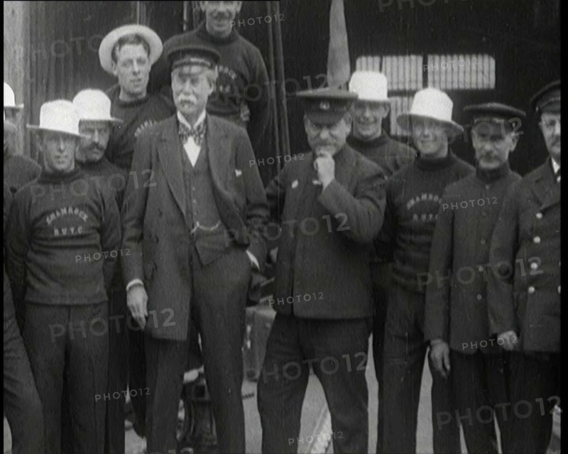 Sir Thomas Lipton Standing With the Crew of the Ship 'The Shamrock', 1920. Creator: British Pathe Ltd.
