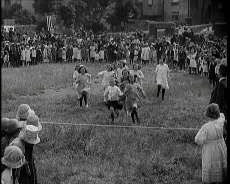 Young Girls Finishing a Running Race in a Field, 1920. Creator: British Pathe Ltd.
