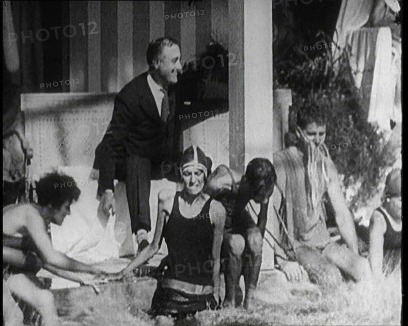American Politician Franklin Delano Roosevelt Laughing as People Around Him Are Jumping..., 1921. Creator: British Pathe Ltd.