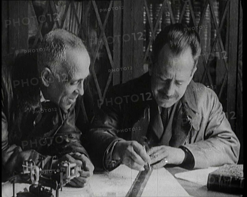 Portuguese Airmen Sacadura Cabral and Gago Coutinho Looking at a Map, 1922. Creator: British Pathe Ltd.