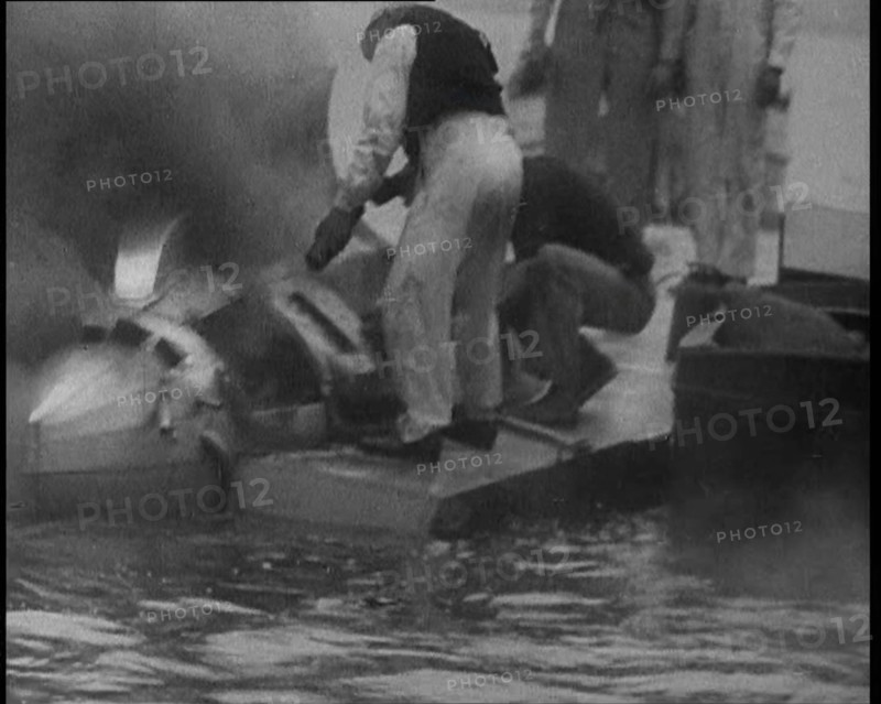 Men Extinguishing a Fire , 1933. Creator: British Pathe Ltd.