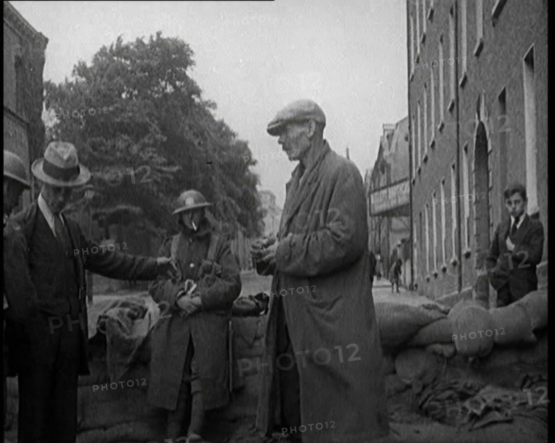 Men Being Stopped and Searched at a Roadblock in Ireland, United Kingdom, 1920. Creator: British Pathe Ltd.