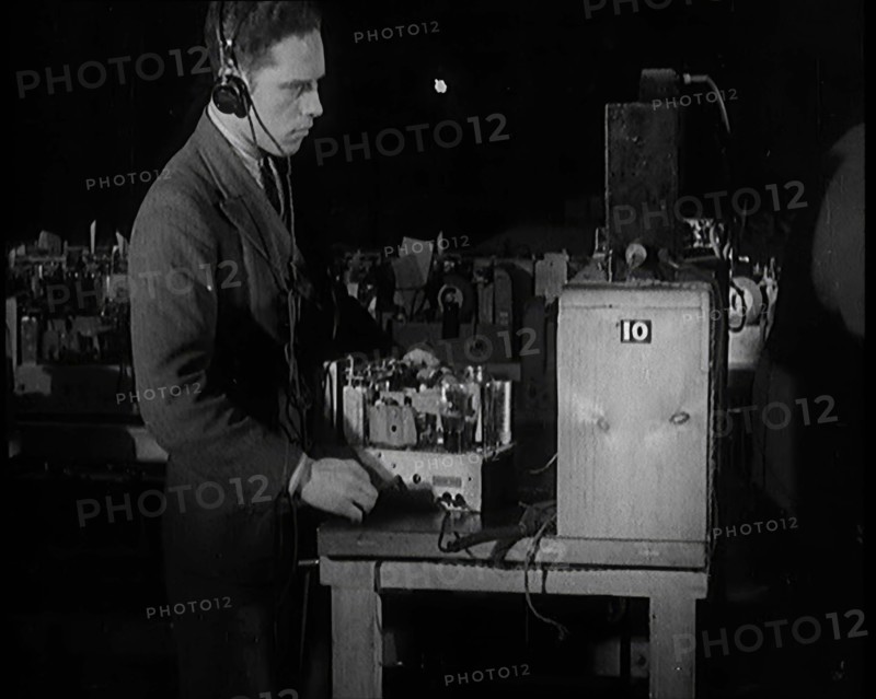 Male Civilian Building a Radio Wireless Set in a Factory, 1931. Creator: British Pathe Ltd.