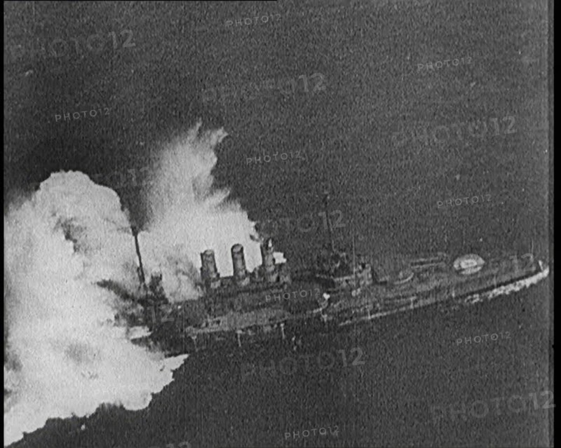 Large Warship Being Hit by an Exploding Shell, 1921. Creator: British Pathe Ltd.