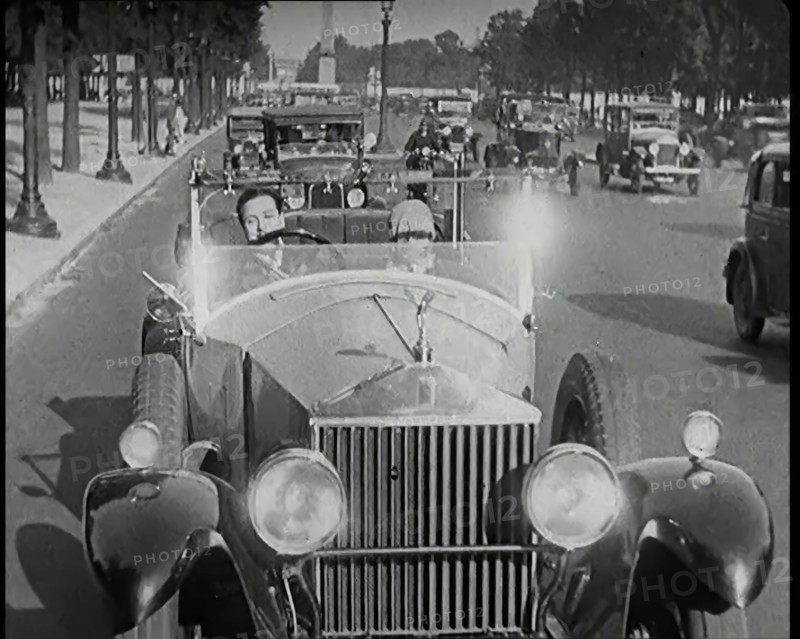 Scene from the Film 'The Compulsory Husband': The Actor Monty Banks Driving a Car With..., 1920s. Creator: British Pathe Ltd.