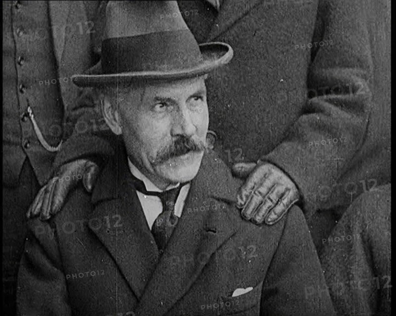 British Prime Minister Ramsay MacDonald Sitting Down. a Pair of Hands Rests on His Shoulders, 1924. Creator: British Pathe Ltd.