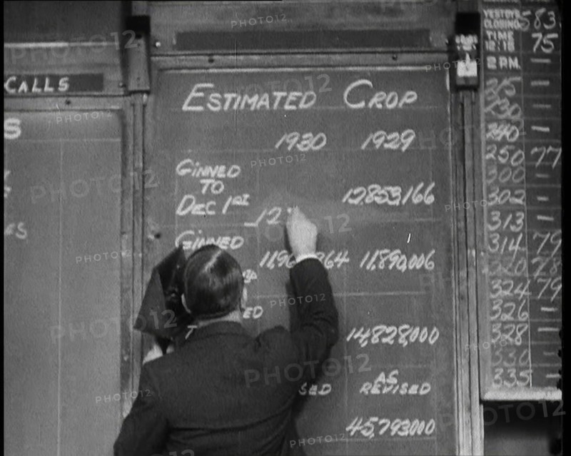 Male Civilian Writing the Newest Stock Prices On a Blackboard, 1932. Creator: British Pathe Ltd.