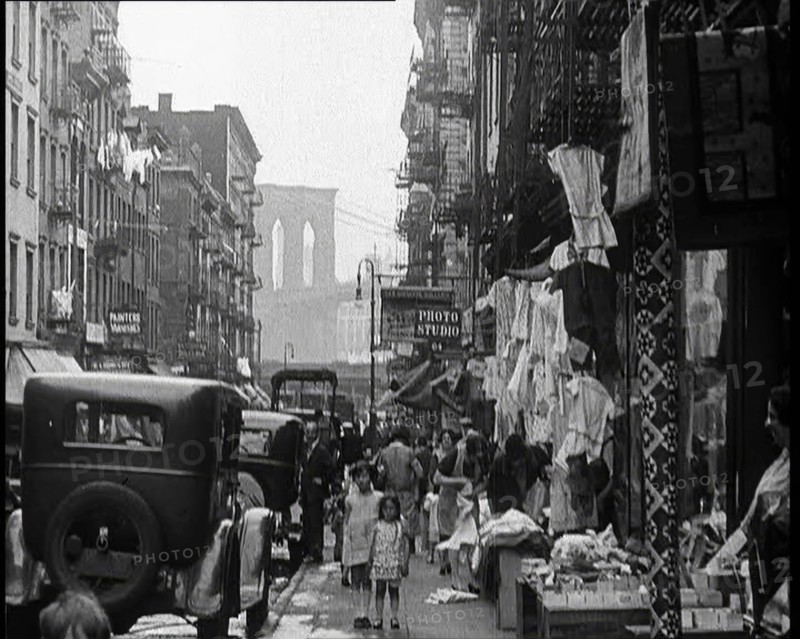 Street View of Street Market Selling Clothes in New York City, 1932. Creator: British Pathe Ltd.