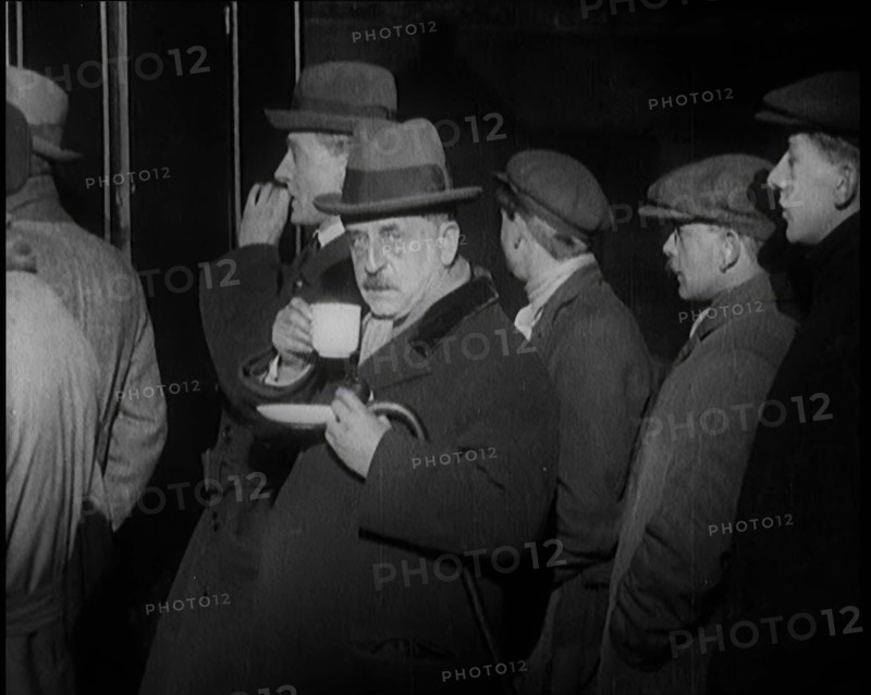 Author Sir James Barrie Drinking a Cup of Tea Surrounded By Male Civilians, 1924. Creator: British Pathe Ltd.