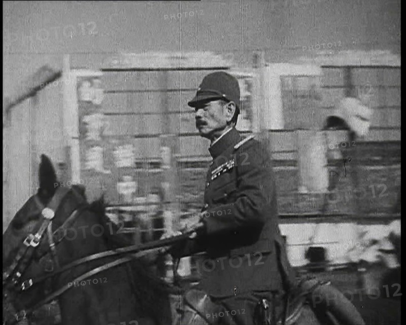 Close up of a Male Japanese Military Officer on Horseback Riding Along a Road During..., 1938. Creator: British Pathe Ltd.