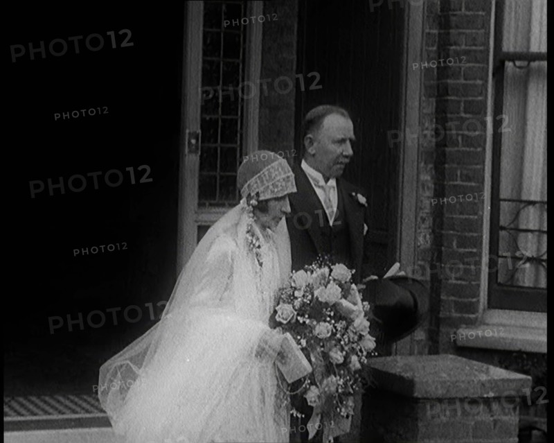 John Henry Thomas and His Daughter Emerging from a Building, 1924. Creator: British Pathe Ltd.