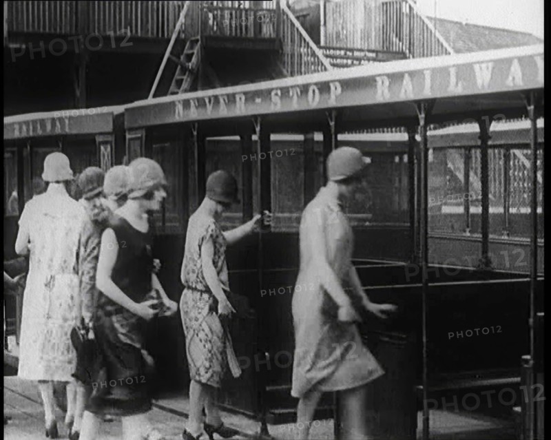 A Group of Female Civilians Board a Carriage of the 'Never Stop Railway', 1924. Creator: British Pathe Ltd.