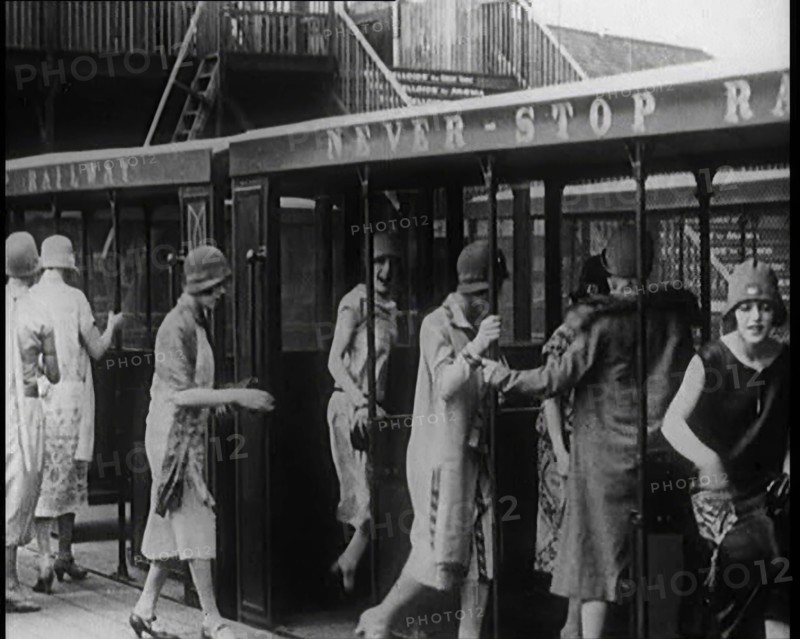A Group of Female Civilians Board a Carriage of the 'Never Stop Railway', 1924. Creator: British Pathe Ltd.