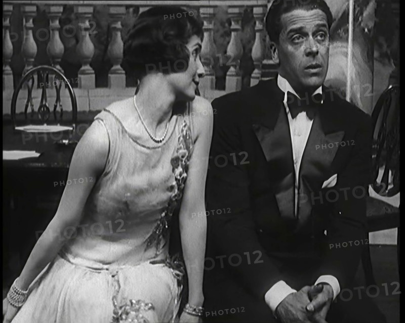 Jack Buchanan and June Knight Sitting on a Bench Together. Buchanan Looking Uncomfortable...,1920s Creator: British Pathe Ltd.