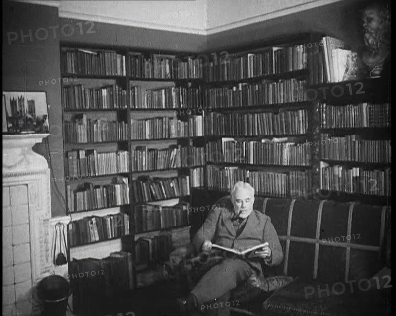 C.E.M Joad Reading a Book, 1930s. Creator: British Pathe Ltd.