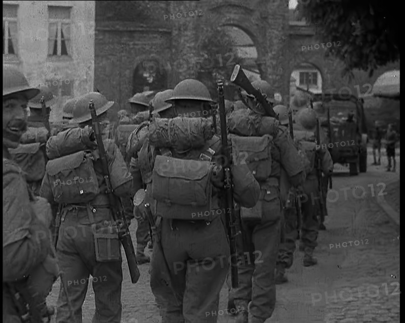 British Soldiers Marching Through a French Town, 1940. Creator: British Pathe Ltd.
