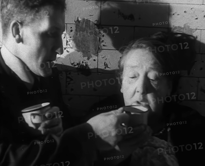 Civilians Drinking Hot Drinks While Sheltering from Bombs in the London Underground, 1940. Creator: British Pathe Ltd.