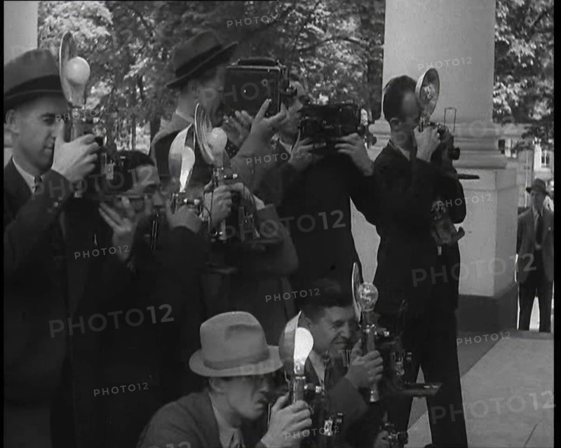 Photographers Photographing Henry Ford Arriving at the White House, 1930s. Creator: British Pathe Ltd.