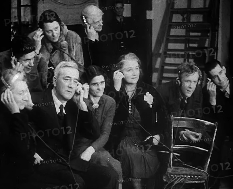 People Listening to Parents Calling Evacuee Children in America Over the Radio, 1940. Creator: British Pathe Ltd.