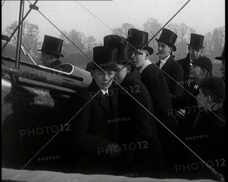 A Group of Young Male British Civilians Admiring an Airplane On an Airfield, 1920s. Creator: British Pathe Ltd.