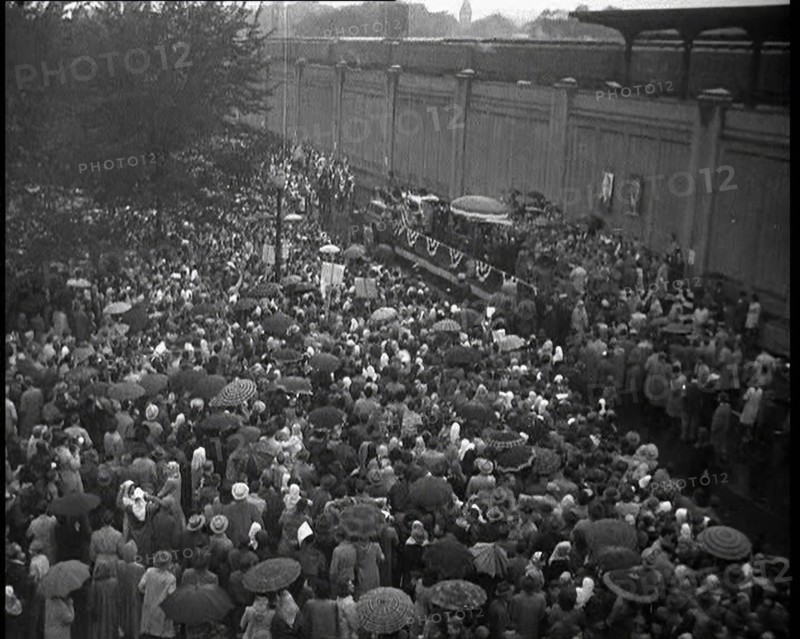 Masses of People Cheering - Many Have Umbrellas As It Is Raining, 1932. Creator: British Pathe Ltd.