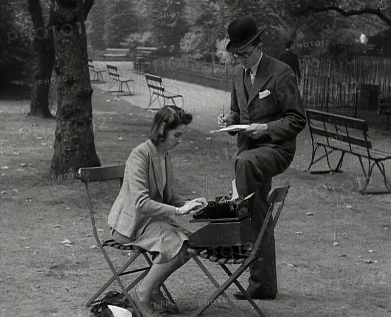 A Man and Woman Taking Notes in a Park, 1941. Creator: British Pathe Ltd.