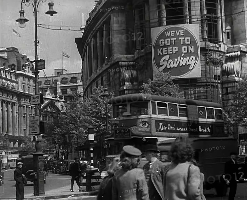 People and Traffic Moving Around a City, 1941. Creator: British Pathe Ltd.