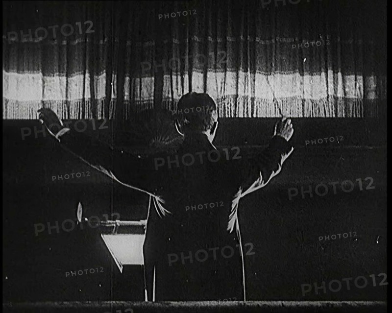 Conductor and Orchestra Performing As the Curtain Raises, 1920s. Creator: British Pathe Ltd.