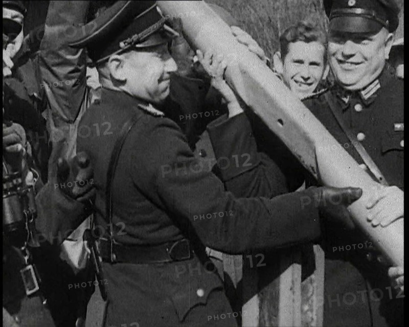 Male German Officers Removing a Barrier at a Checkpoint on the Border Between Germany and..., 1938. Creator: British Pathe Ltd.