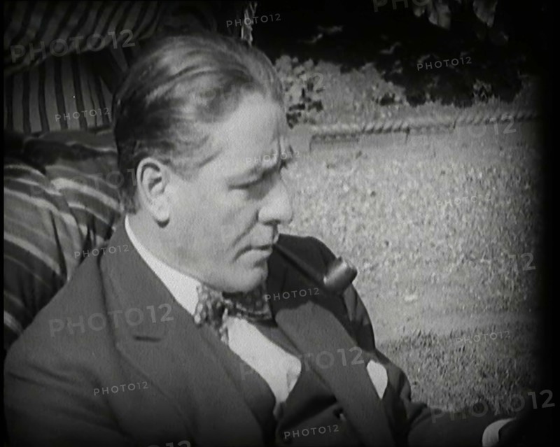 Matheson Lang Relaxing in a Deck Chair Smoking a Pipe, 1920s. Creator: British Pathe Ltd.