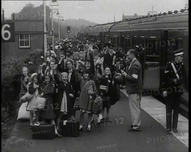 British Male and Female Evacuees on the Platform of a Small Station in the British Country..., 1939. Creator: British Pathe Ltd.
