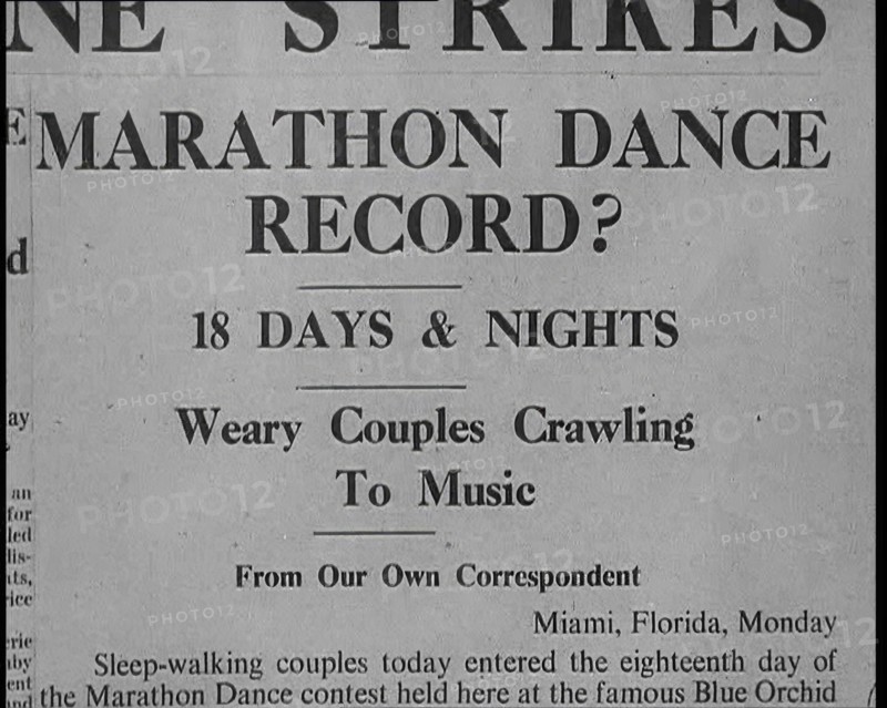 Newspaper Reading: ‘Marathon Dance Record?’, 1930s. Creator: British Pathe Ltd.