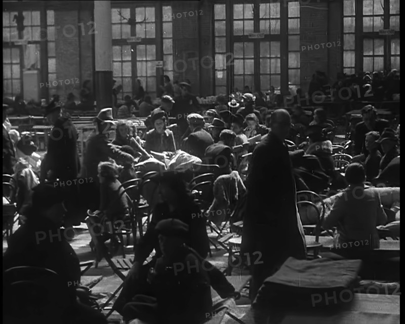 Dutch Refugees Sitting and Eating at a Reception Centre in the United Kingdom, 1940. Creator: British Pathe Ltd.