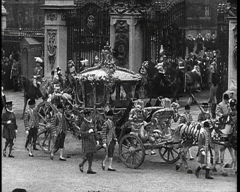 The Royal Coach, Horses, and Procession Filing Out of the Gates and Turning Left at the..., 1937. Creator: British Pathe Ltd.