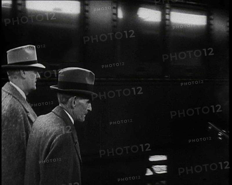 Henry Ford Walking Along a Train Station Platform, 1930s. Creator: British Pathe Ltd.