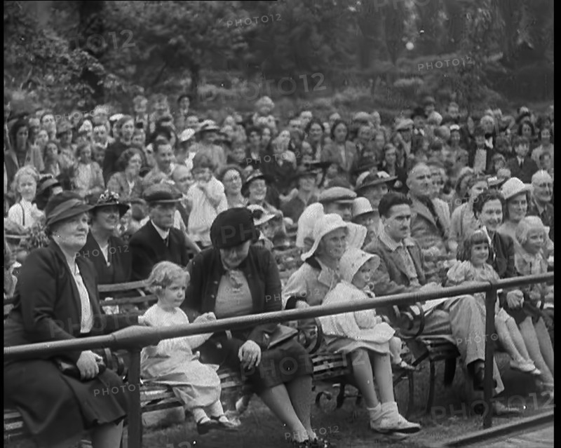 British People Watching Chimpanzees Having a Tea Party at the Zoo, 1940. Creator: British Pathe Ltd.