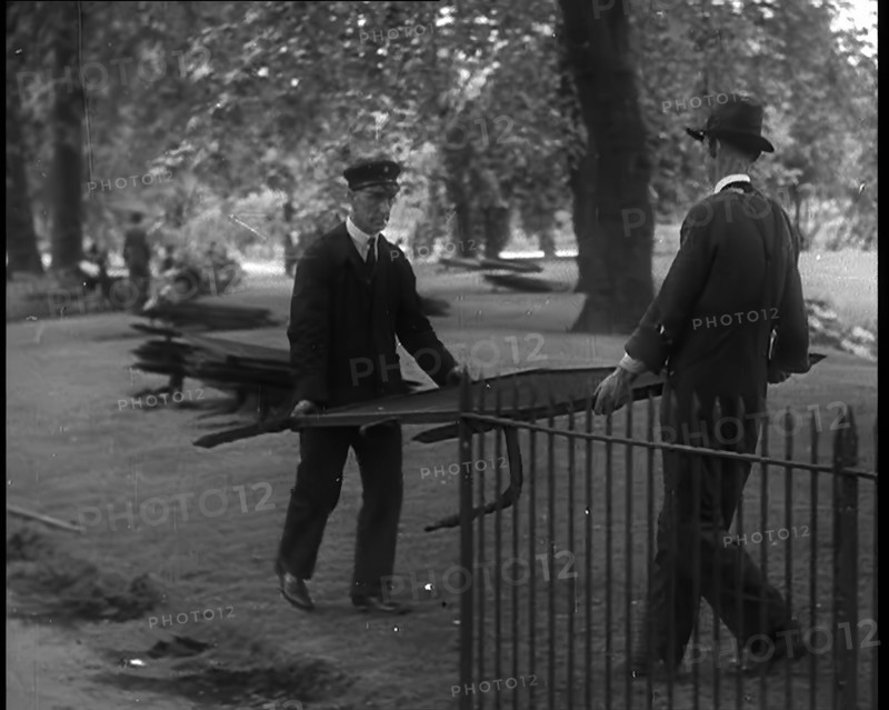 Men Removing Park Railings for Use in Factories, 1940. Creator: British Pathe Ltd.