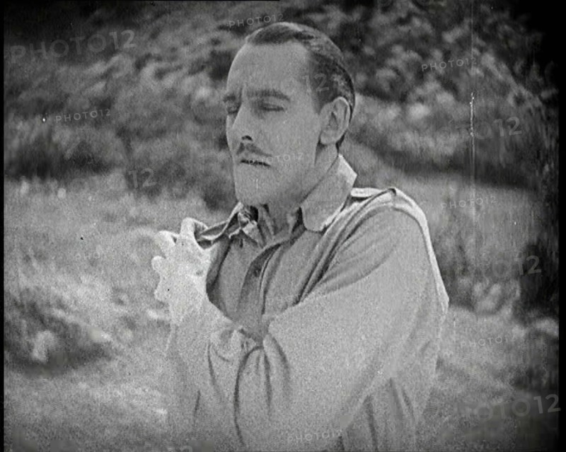 Scene from the Feature Film 'The White Sheik'. An Actor Portraying a Male Soldier Grabbing..., 1920s Creator: British Pathe Ltd.