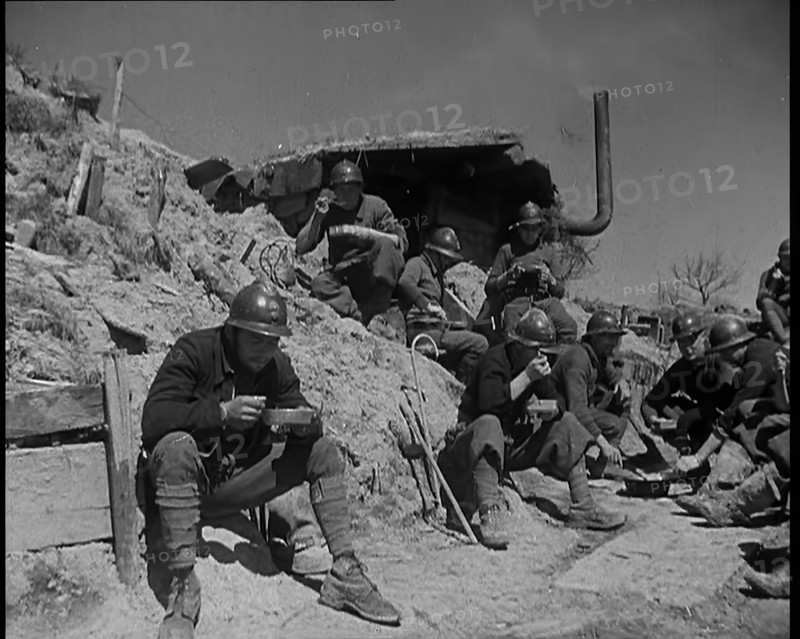 French Soldiers Eating a Meal in a Dug Out, 1940. Creator: British Pathe Ltd.