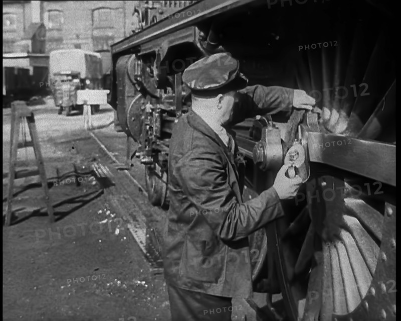 A Man Doing Maintenance Work on a Train Carriage, 1940. Creator: British Pathe Ltd.