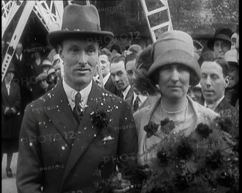 Male Civilian (Groom) And Female Civilian (Bride) Emerging from a Church To Walk Through an...,1927 Creator: British Pathe Ltd.