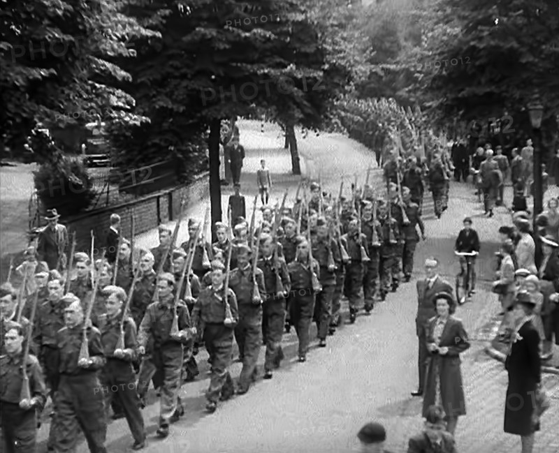 British Local Defence Volunteers Marching in Parade, 1940. Creator: British Pathe Ltd.
