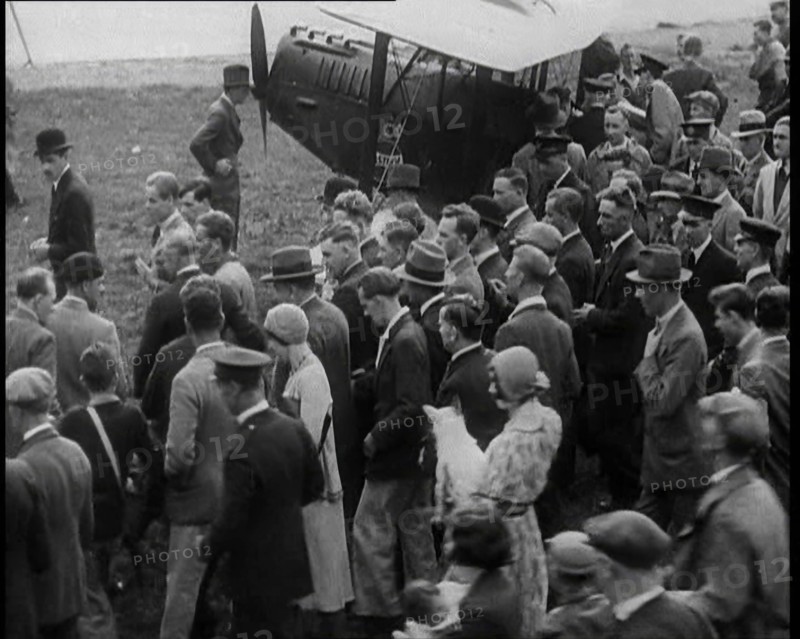 Jim Mollison Walking to His Plane With a Large Crowd, 1930s. Creator: British Pathe Ltd.