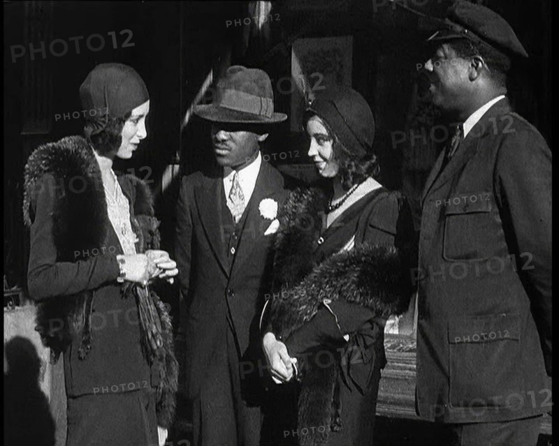Smartly Dressed People in Conversation On the Streets of New York City, 1932. Creator: British Pathe Ltd.