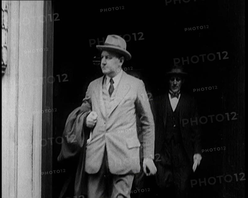 Two Male Civilians Emerging from a Building, 1924. Creator: British Pathe Ltd.