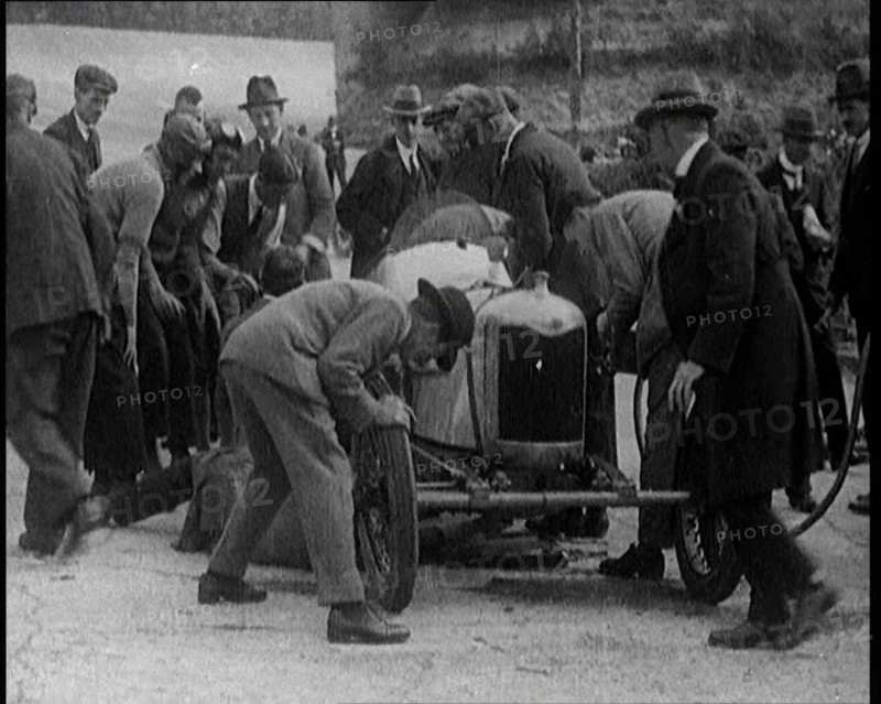 A Group of Male Civilians Working on a Car, 1924. Creator: British Pathe Ltd.