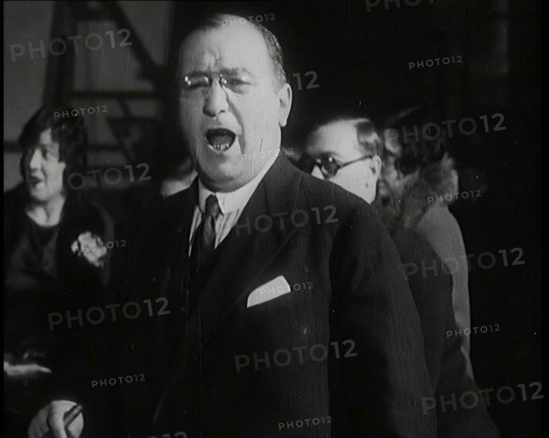 Female Civilian Singing Scales Badly Whilst Other Female Civilian is Playing the Piano in..., 1920s. Creator: British Pathe Ltd.