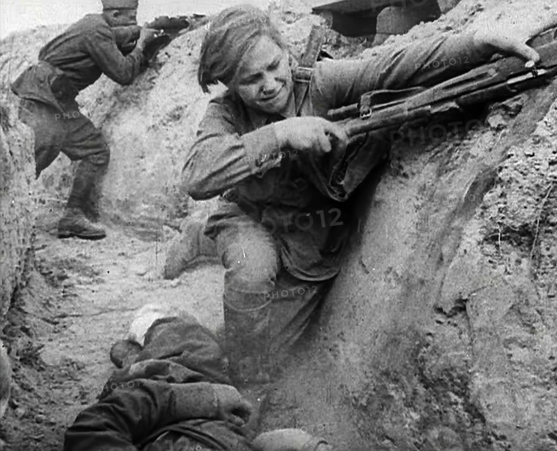 Two Russian Soldiers Taking Cover in a Trench, 1941. Creator: British Pathe Ltd.