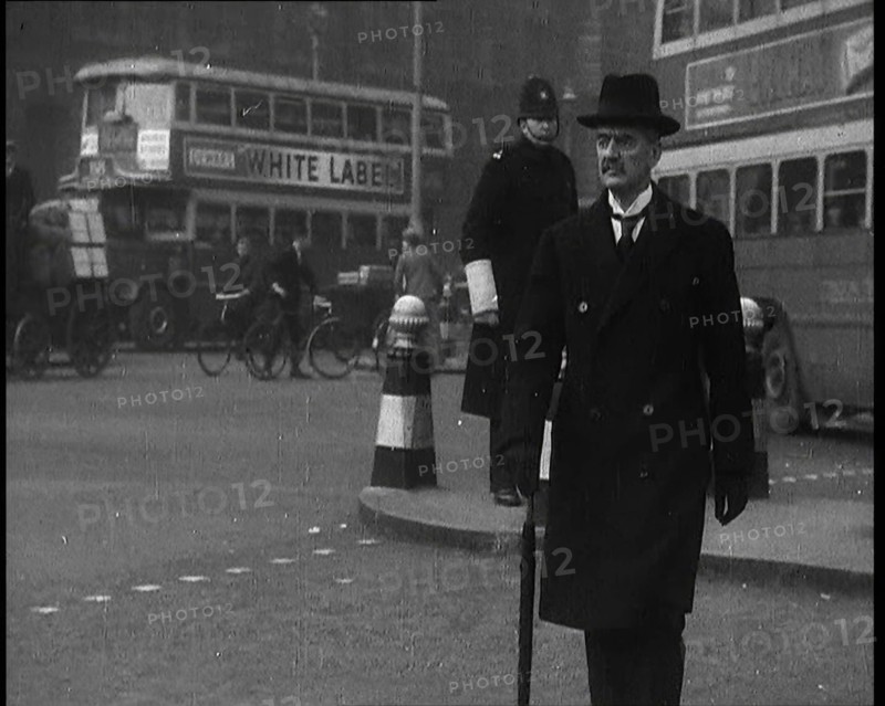 Neville Chamberlain, British Politician, Walking Across a London Street, 1937. Creator: British Pathe Ltd.